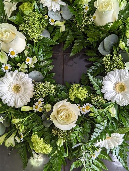Cream rose and gerbera wreath tribute